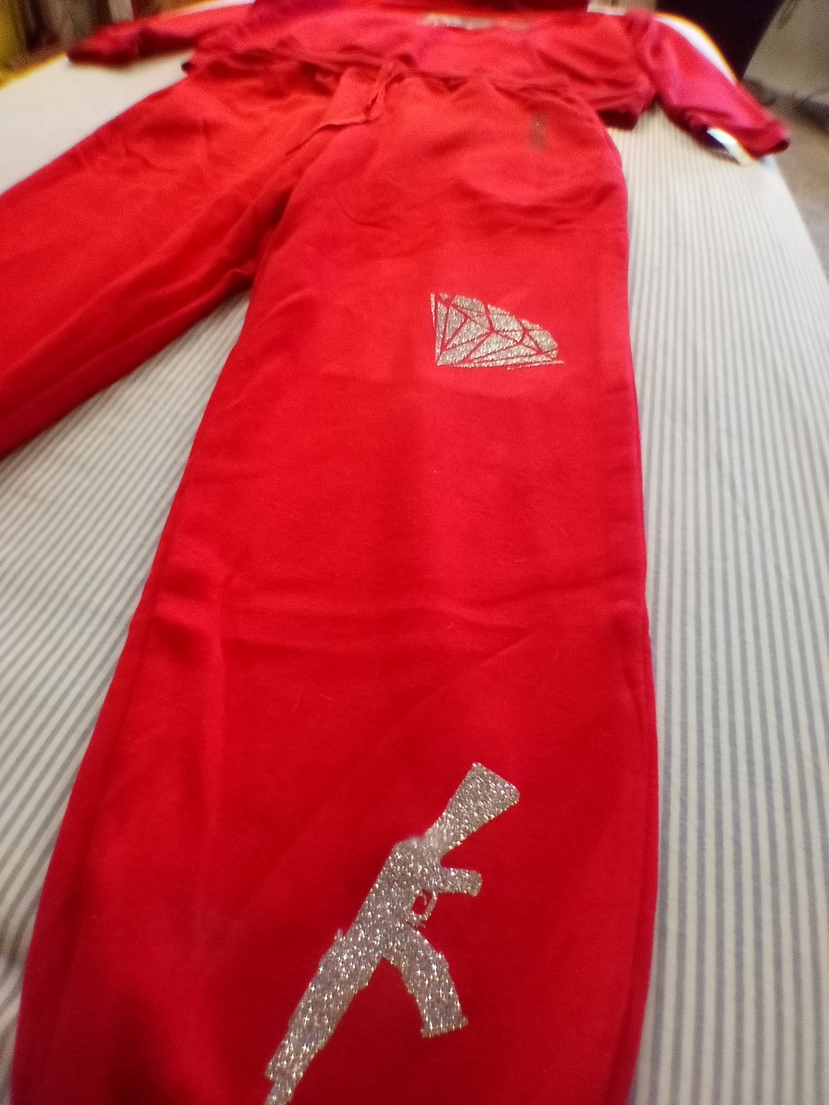 Red trust no one track suit