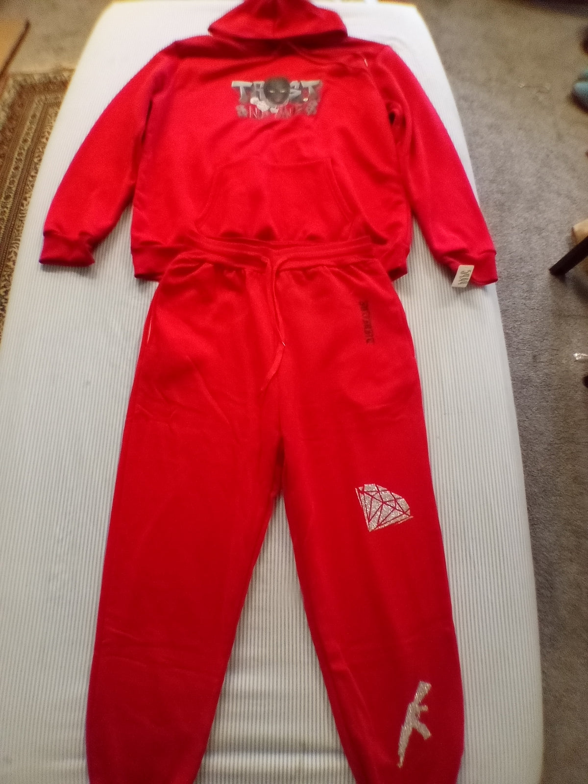 Red trust no one track suit