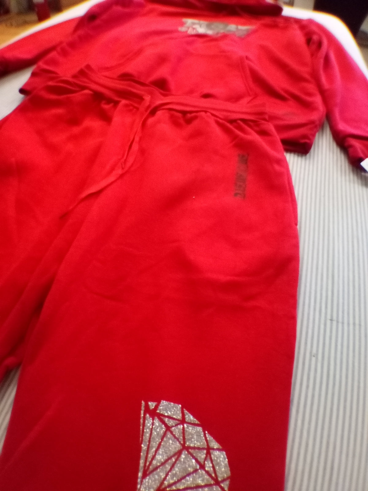Red trust no one track suit