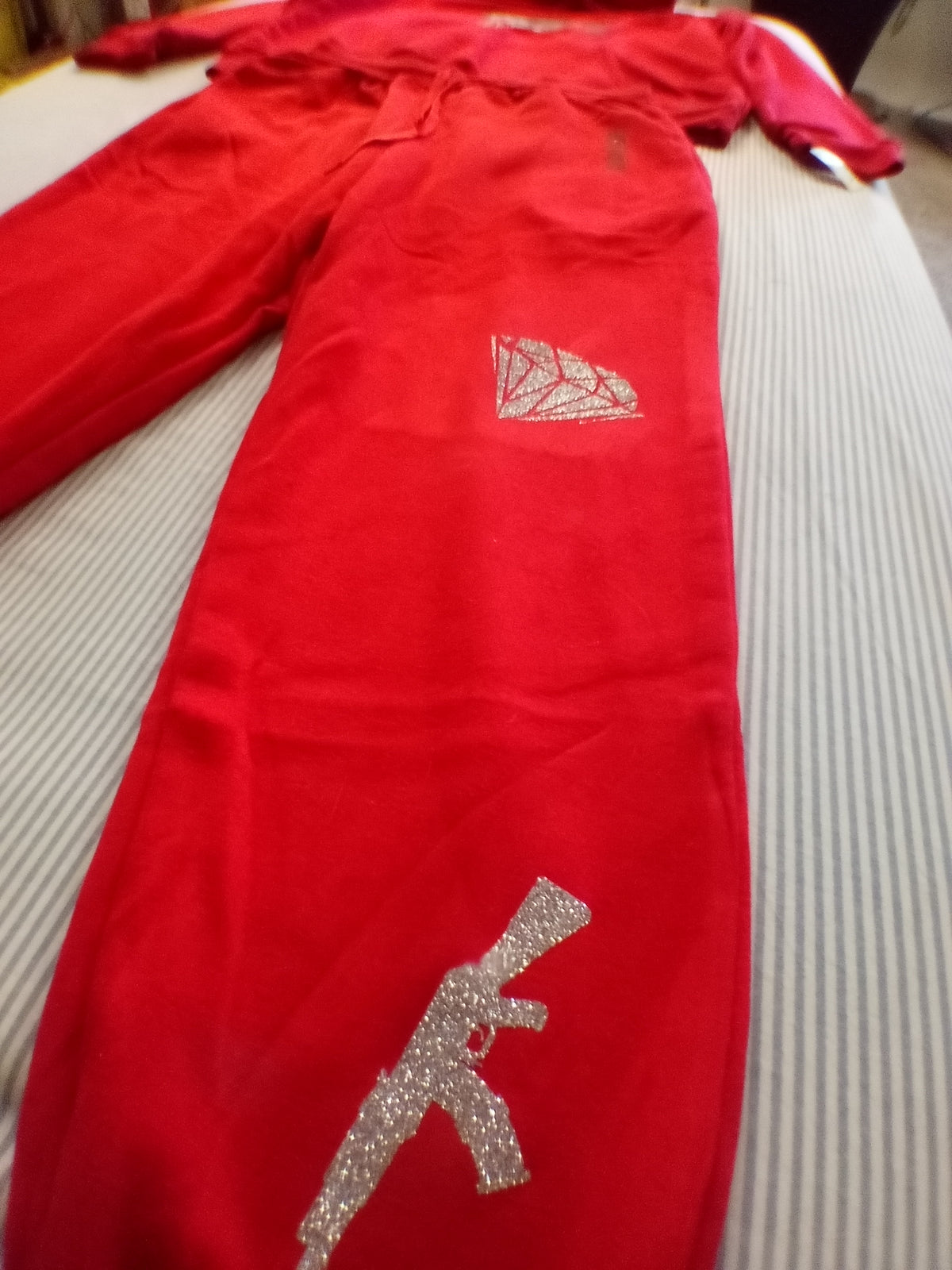 Red trust no one track suit